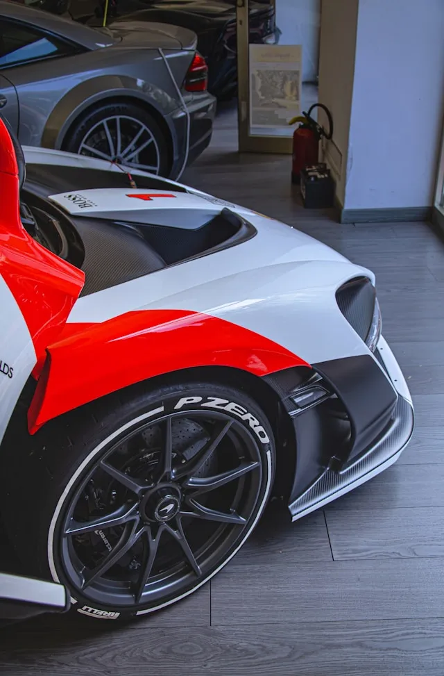 White and red two-tone supercar livery over carbon fiber
