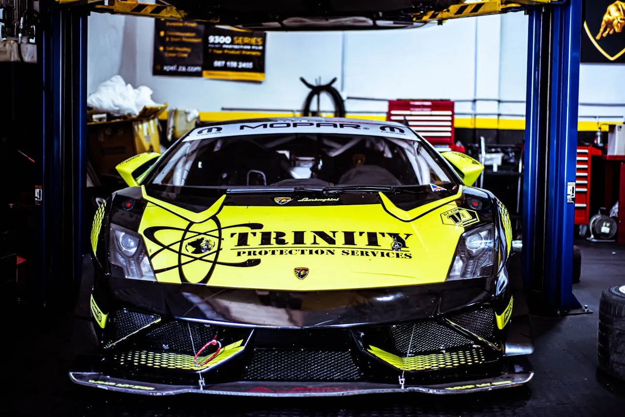 Black and neon yellow supercar race wrap with large hood logo lettering